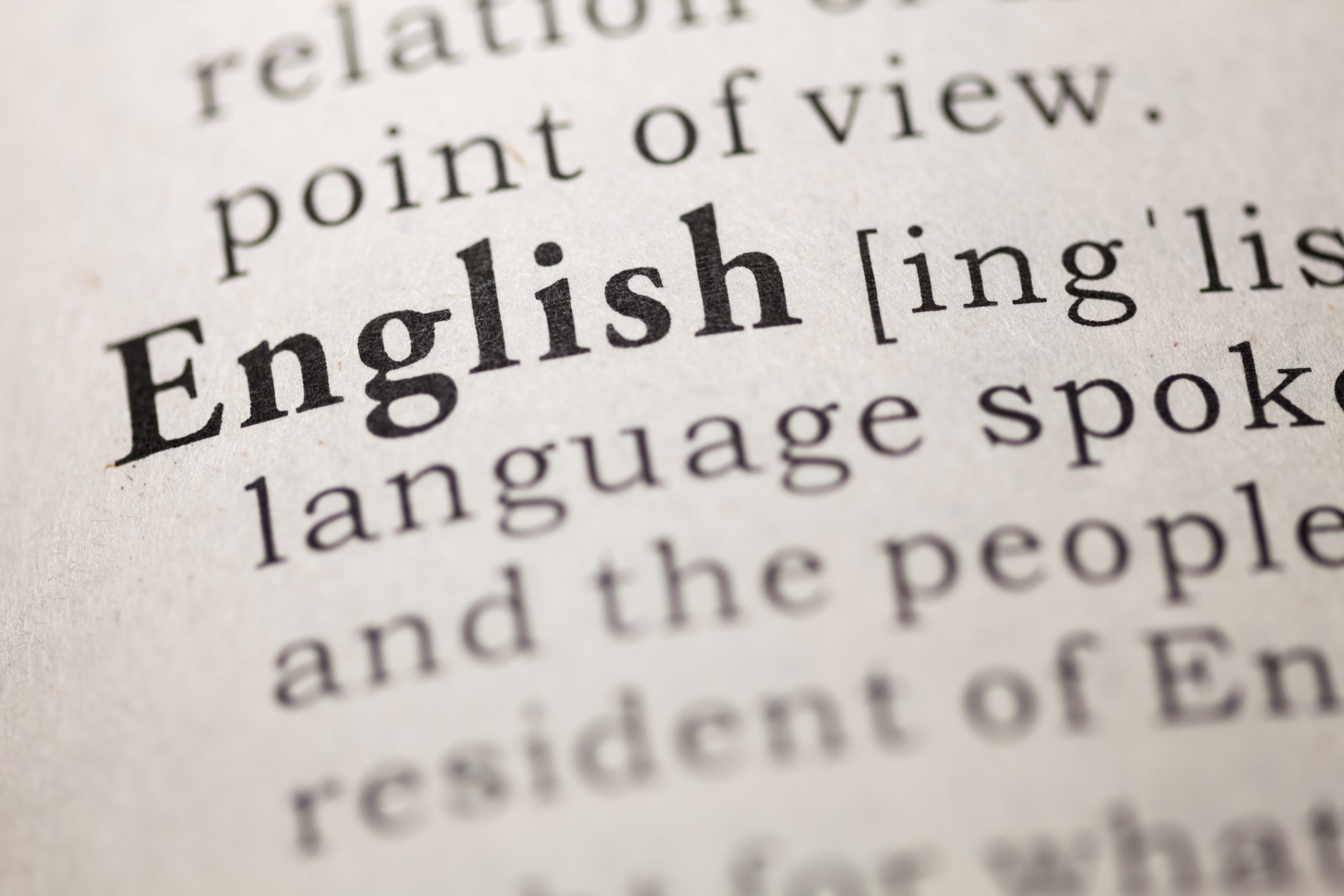 A close up of the word "English" in a dictionary
