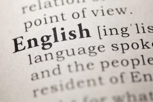 A close up image of the word "English" in a dictionary