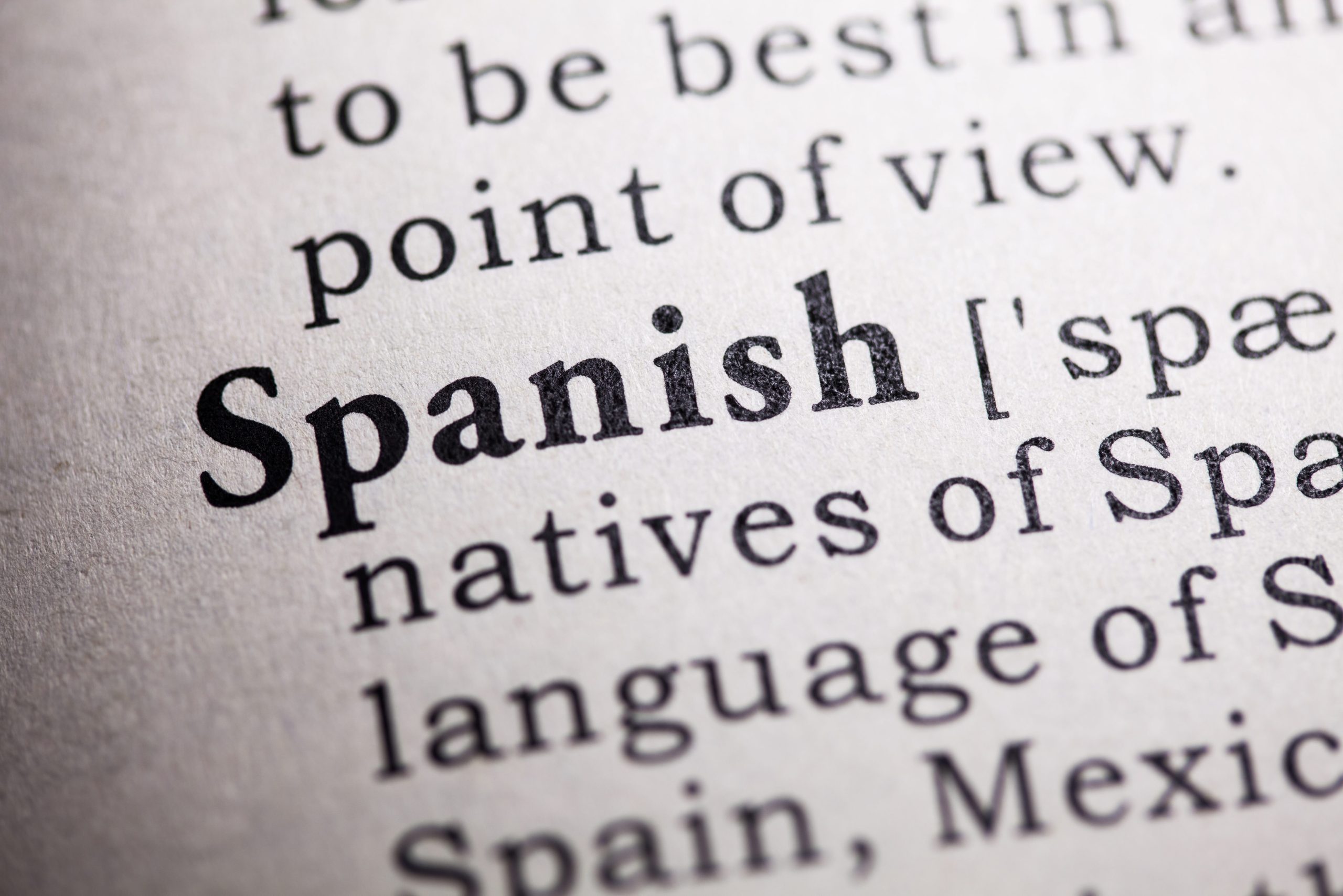 A close up of the word "Spanish" in a dictionary