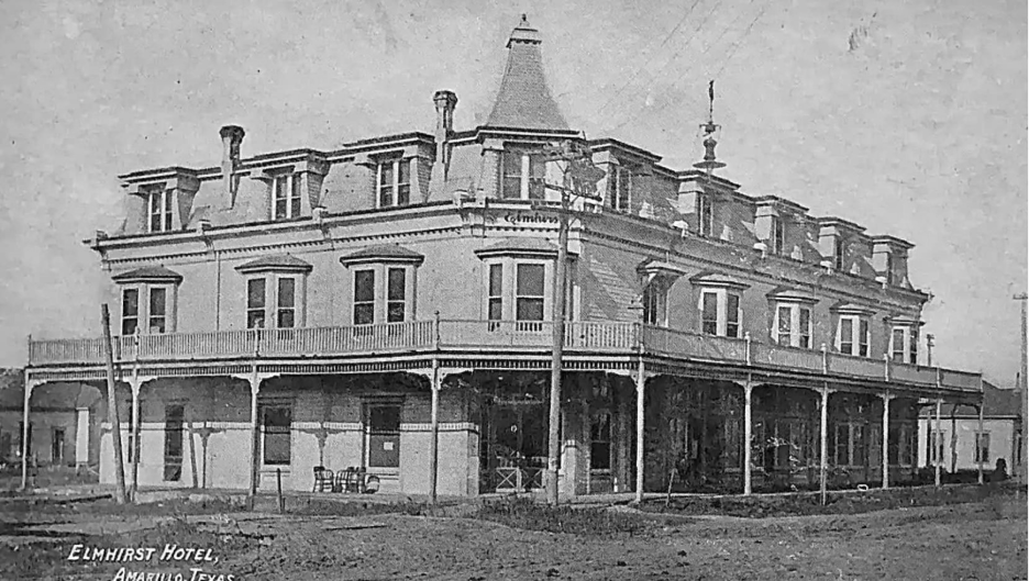 A vintage photo of the Elmhirst Hotel with a small peak at the Amarillo Public Library in the right corner of the image