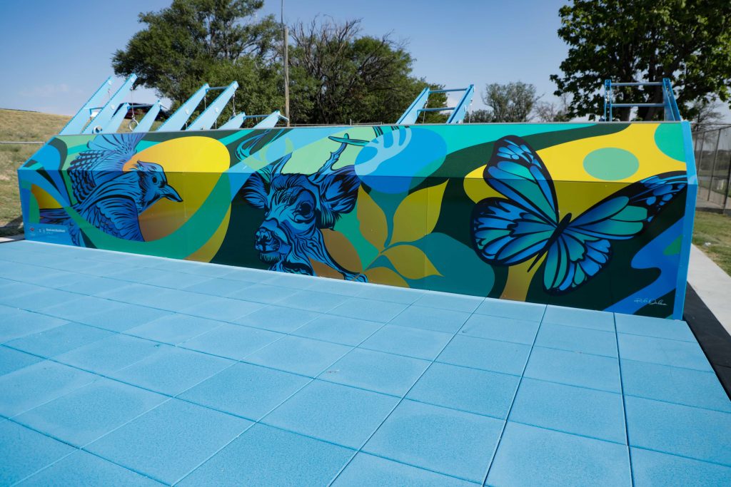 The back side of Amarillo's new Fitness Court at John Ward Memorial Park featuring a new mural and expansive workout area