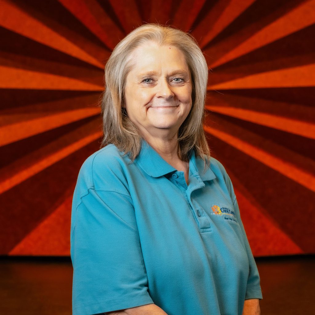 Headshot of Civic Center's Assistant Box Office Manager Dina Lill wearing a blue short sleeve polo