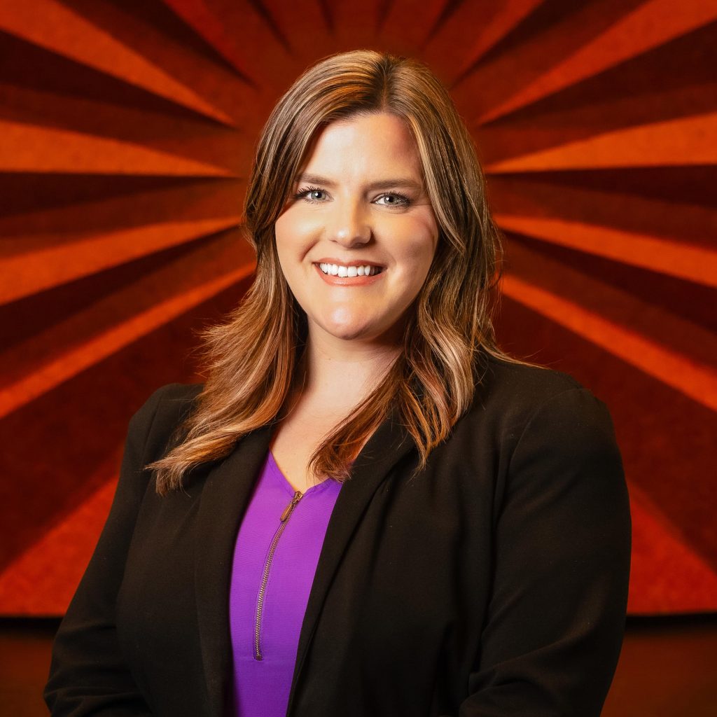 Headshot of Civic Center's Events Manager Mandy Smoot wearing a black blazer and purple shirt