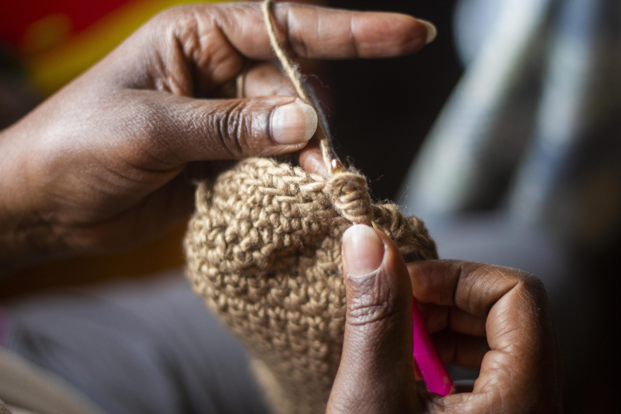 A close up of someone knitting