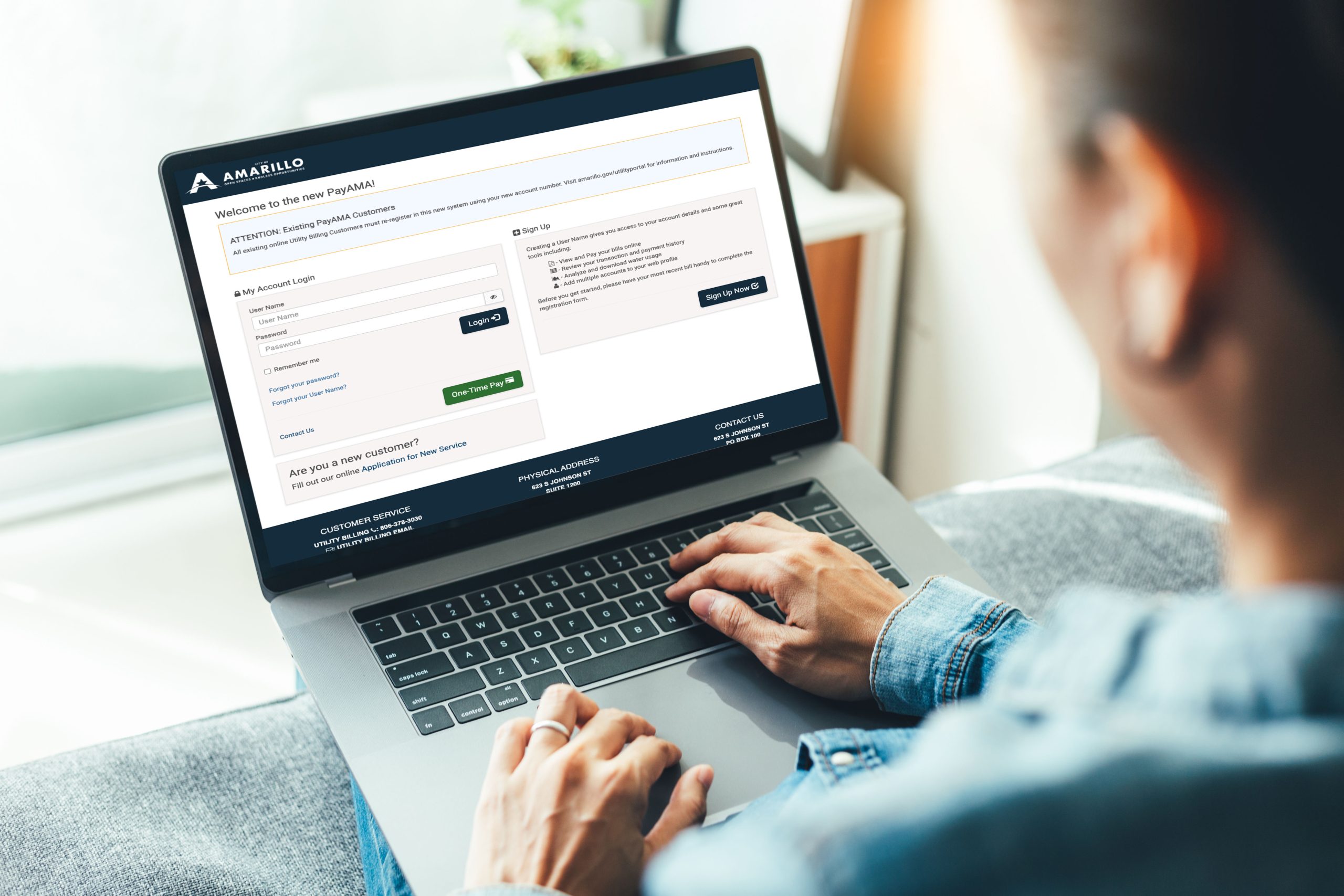 A person on their laptop accessing the PayAMA portal