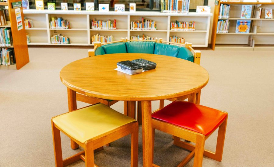 A youth-sized table, chairs, and reading nook at the East Branch