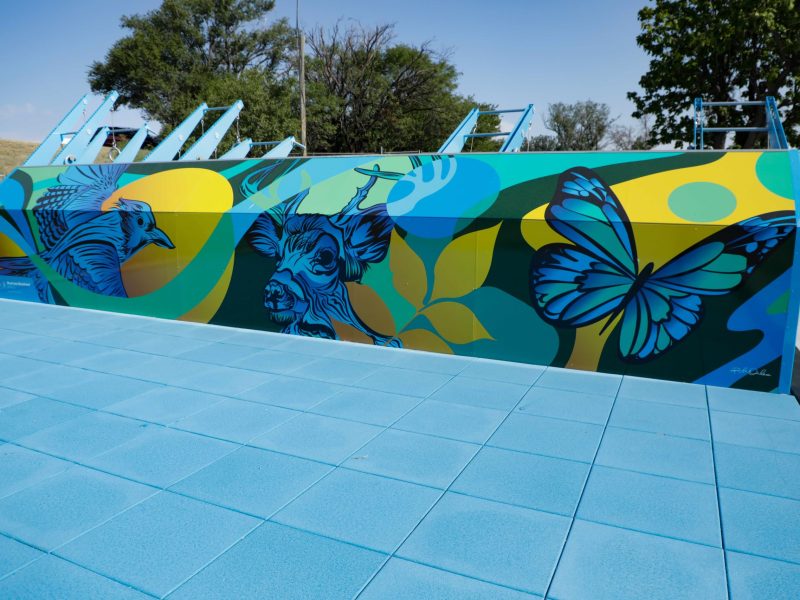 The back side of Amarillo's new Fitness Court at John Ward Memorial Park featuring a new mural and expansive workout area