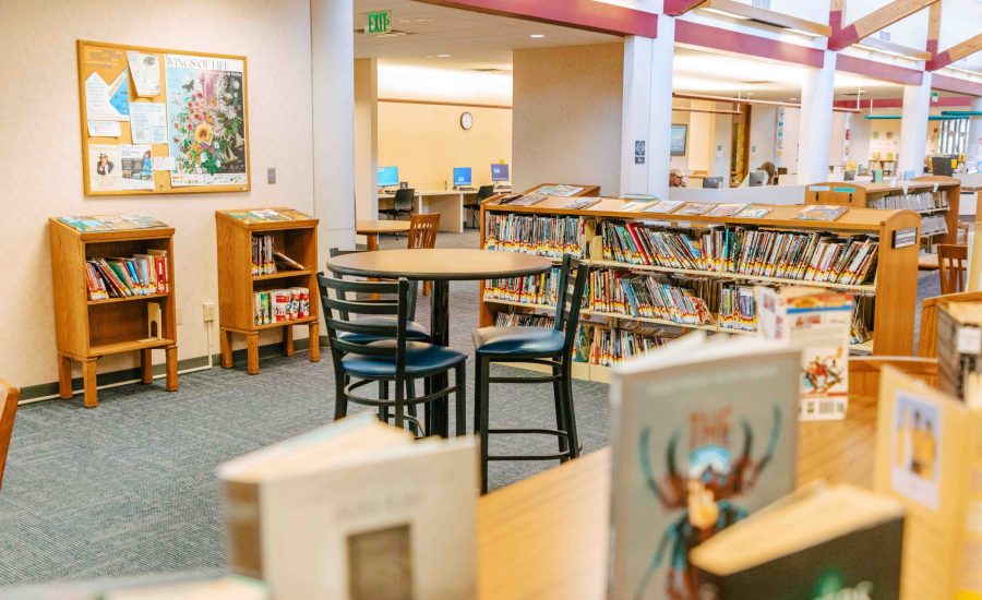 The Young Adult section at the Southwest Branch with bookshelves and a bistro-style table